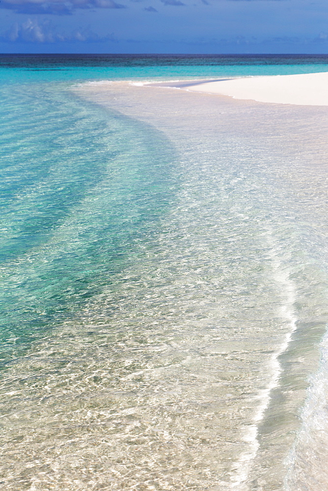 The crystal clear water of the Indian Ocean and a deserted beach on an island in the Maldives, Indian Ocean, Asia