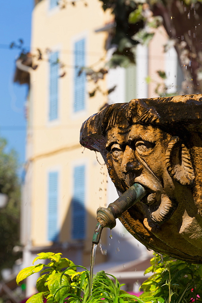 Fountain in the form of a man in Cassis old town, Cassis, Provence, France, Europe