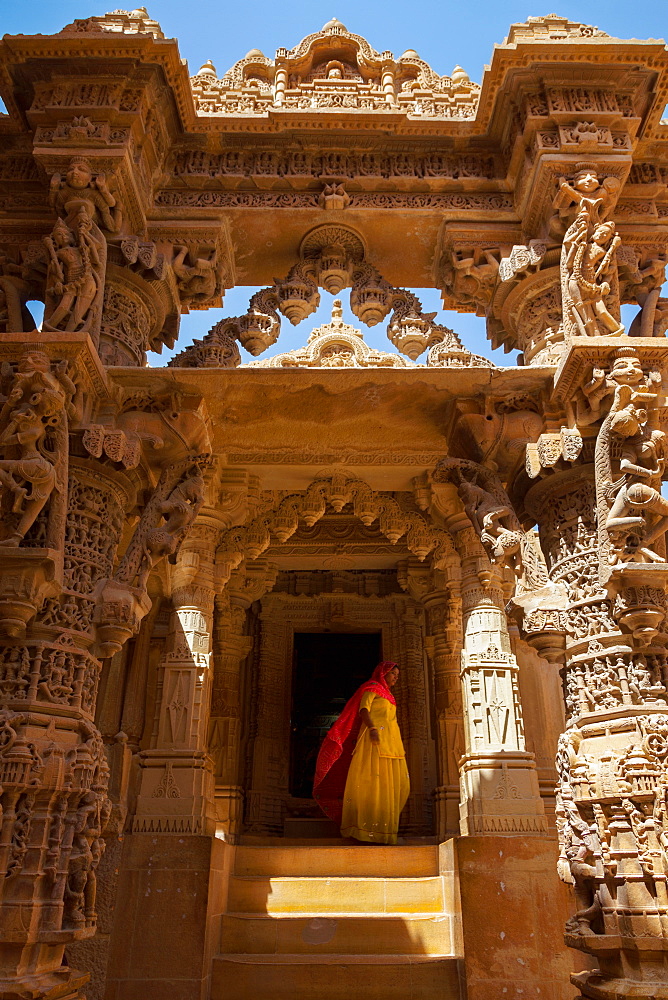 Indian lady in traditional dress in a temple in Jaisalmer, Rajasthan, India, Asia