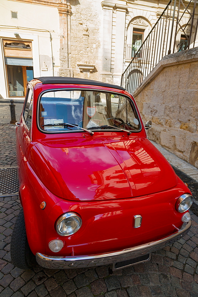 Old Fiat car parked in a quiet side street in Noto, Sicily, Italy, Europe