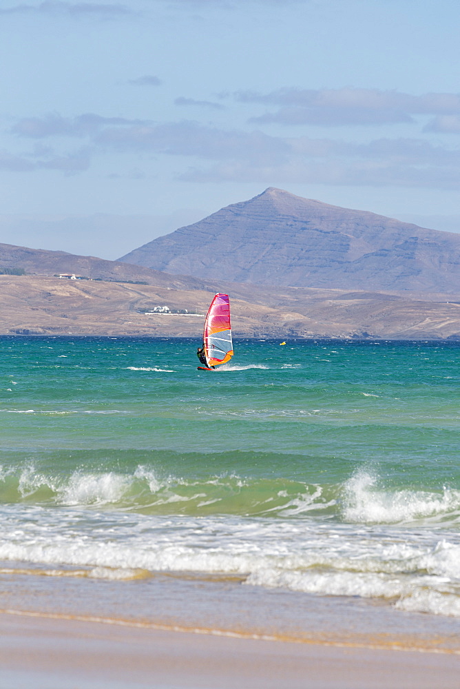 Wind-surfer off Playa de La Barca, Costa Calma, on the volcanic island of Fuerteventura, Canary Islands, Spain, Atlantic, Europe