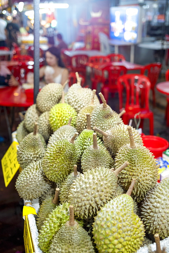 A display of Durian fruit for sale in Bukit Bintang food street at night in the capital city of Kuala Lumpur, Malaysia, Southeast Asia, Asia