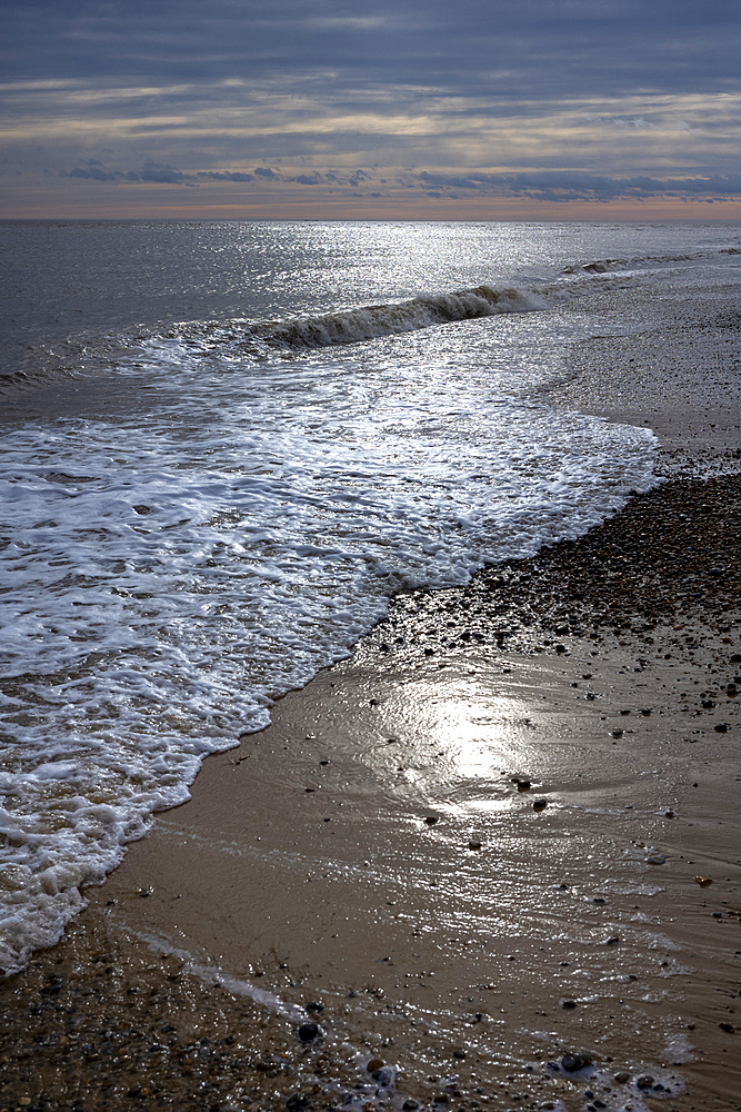Waves on the shoreline of the North Sea at Southwold beach, United Kingdom