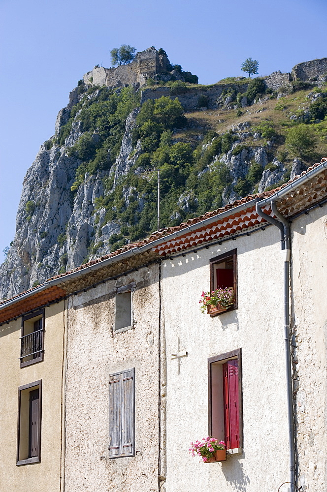 House and Cathar castle, Roquefixade, Ariege, Midi-Pyrenees, France, Europe