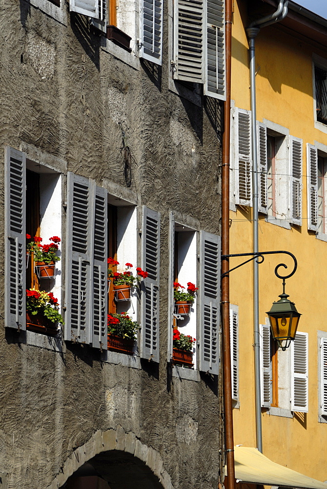 Flower bedecked shuttered windows, Rue Sainte-Claire, Annecy, Rhone Alpes, France, Europe