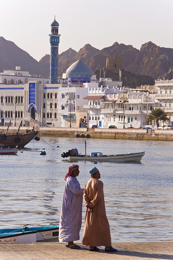 The Corniche, latticed white houses and Mutrah Mosque in the early morning, Mutrah, Muscat, Oman, Middle East