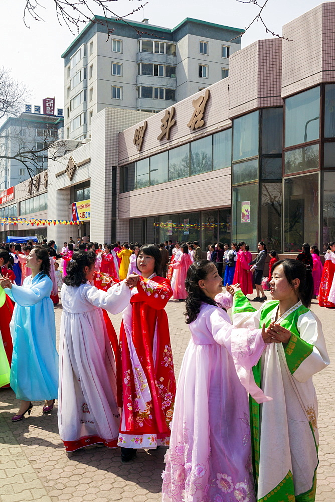 Women in traditional dress dancing during street celebrations on the 100th anniversary of the birth of President Kim Il Sung, April 15th 2012, Pyongyang, Democratic People's Republic of Korea (DPRK), North Korea, Asia