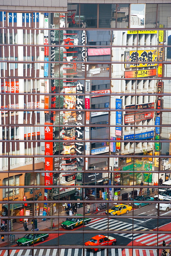 Street scene reflections at a busy Shibuya intersection, Tokyo, Honshu, Japan, Asia