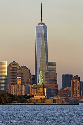 Statue of Liberty, One World Trade Center and Downtown Manhattan across the Hudson River, New York, United States of America, North America