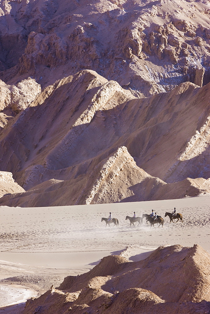 Tourists horse trekking, Valle de la Luna (Valley of the Moon), Atacama Desert, Norte Grande, Chile, South America