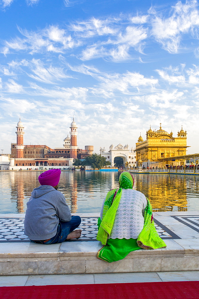 Sikhs at The Golden Temple (Harmandir Sahib) and Amrit Sarovar (Pool of Nectar) (Lake of Nectar), Amritsar, Punjab, India, Asia