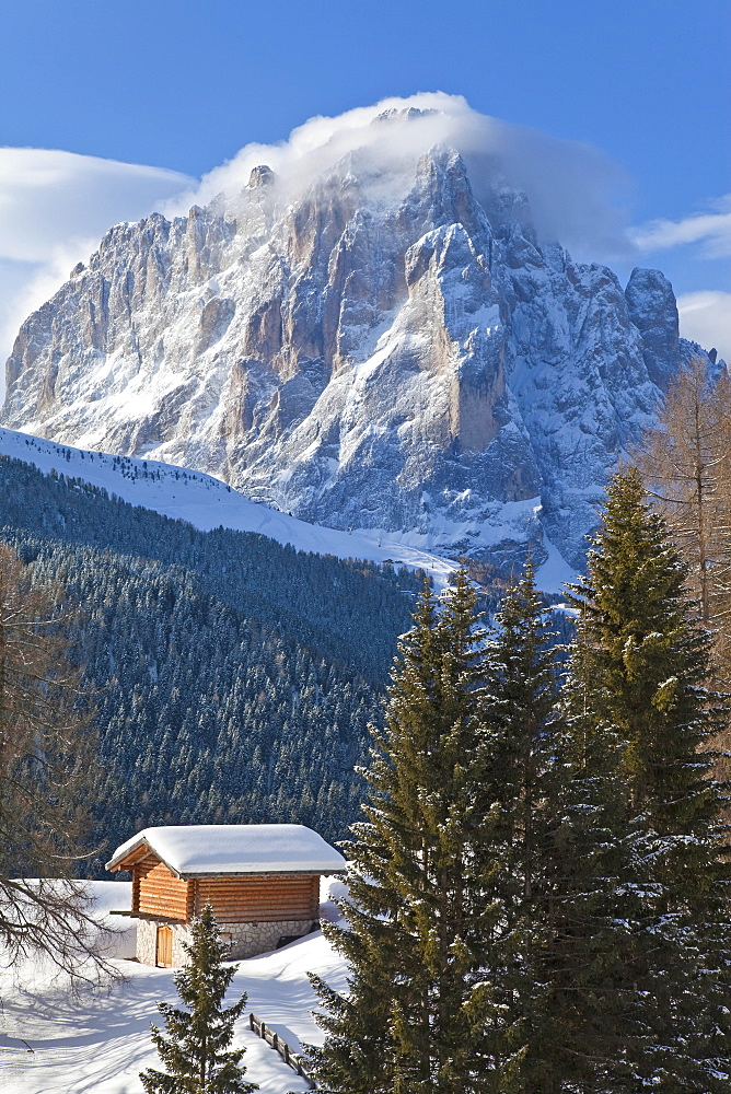 Winter snow covered mountain hut in front of Sassolungo mountain, 3181m, Val Gardena, Dolomites, South Tirol, Trentino-Alto Adige, Italy, Europe