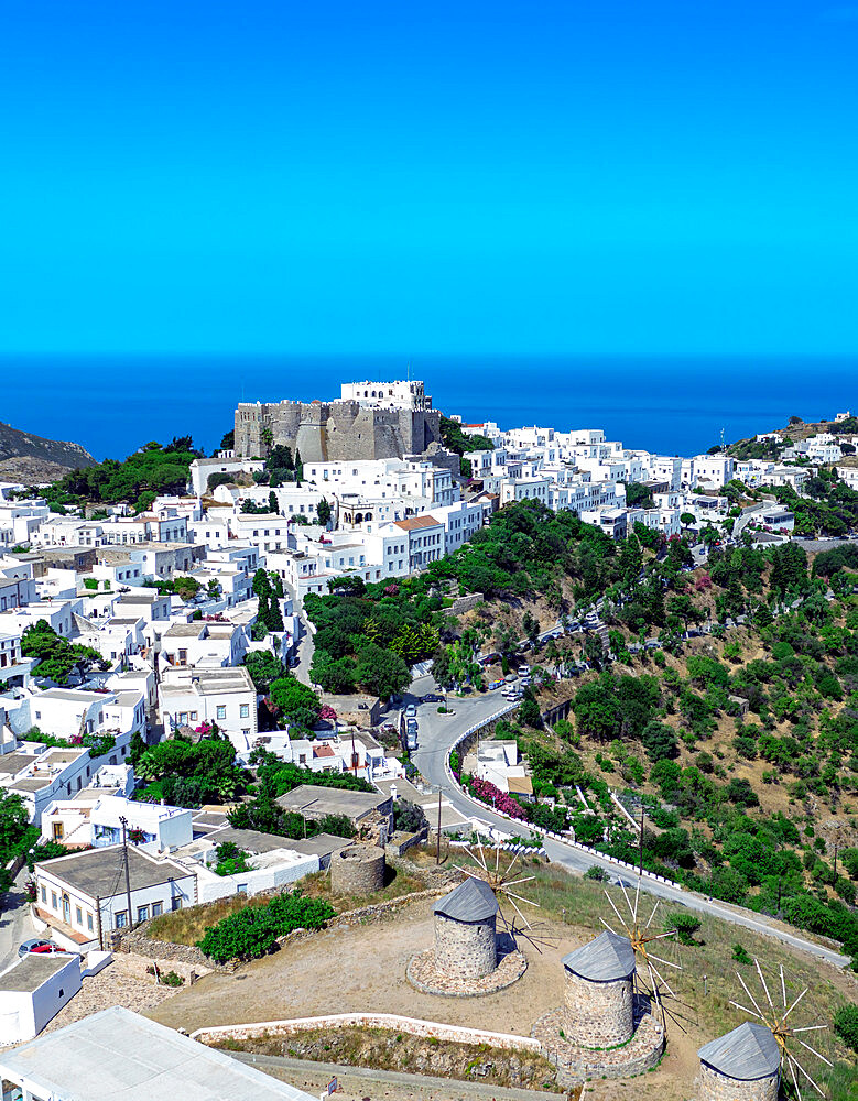 Ancient windmills in Chora overlooking the Monastery of Saint John the Theologian, UNESCO World Heritage Site, Patmos, Greek Islands, Greece, Europe