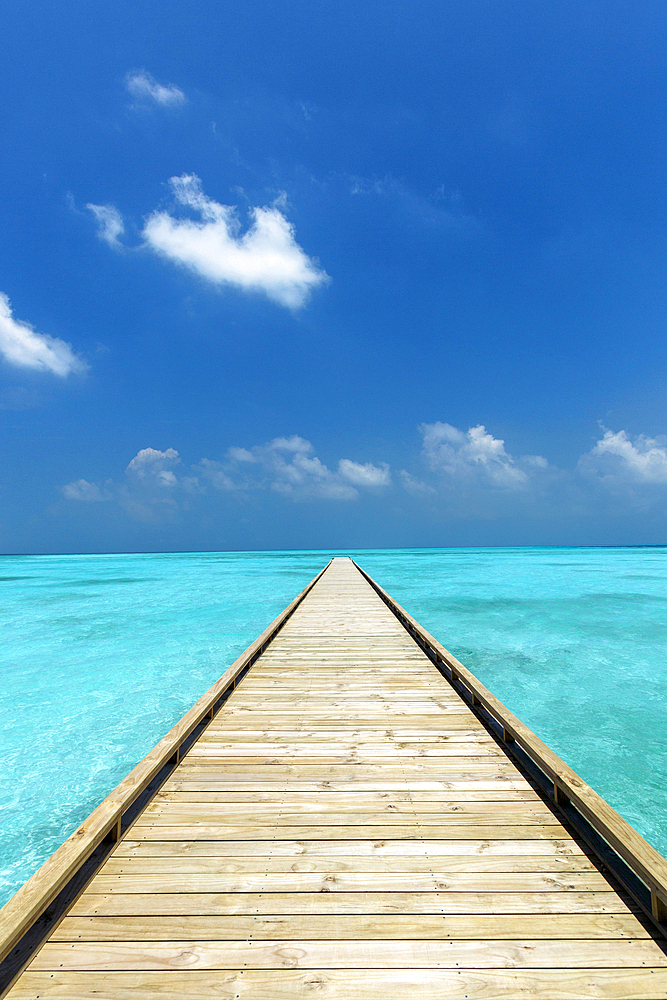 Wooden Jetty out to tropical Sea, The Maldives, Indian Ocean, Asia