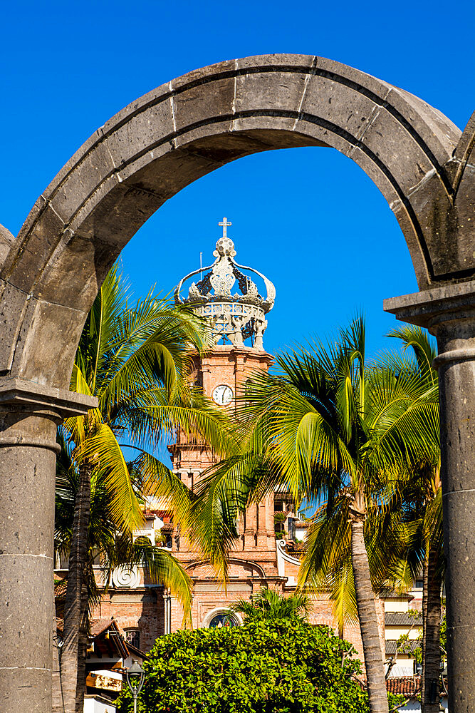 Our Lady of Guadalupe church through the Malecon arches, Puerto Vallarta, Jalisco, Mexico, North America