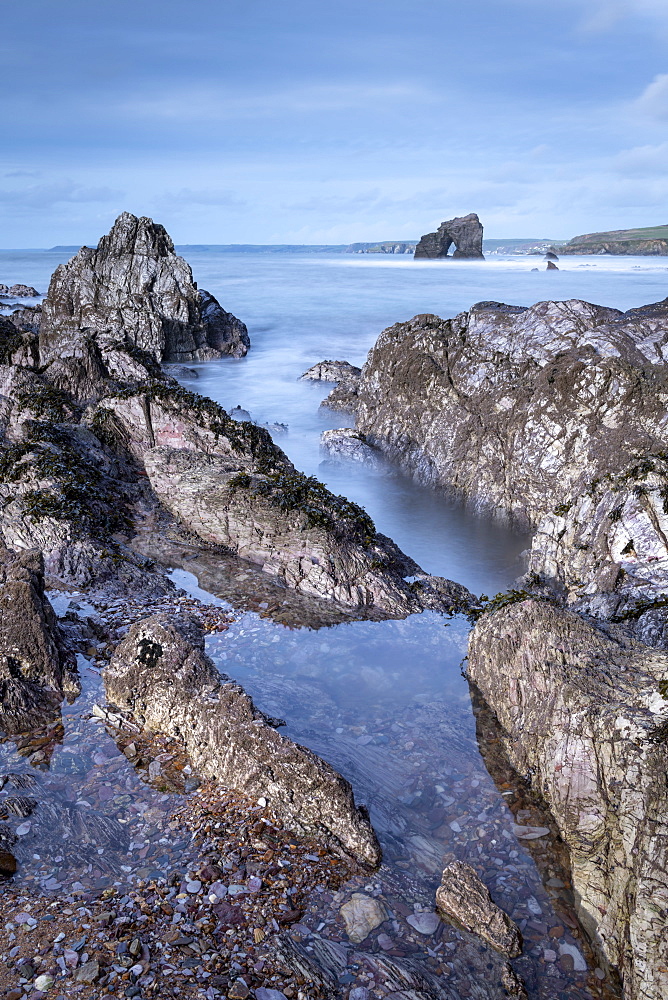 Thurlestone Rock from the rocky shores of South Milton Sands, South Hams, Devon, England, United Kingdom, Europe