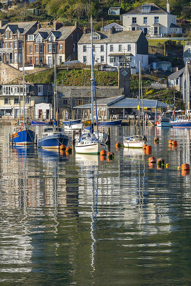 Boats moored in Looe's pretty harbour at dawn in spring, Looe, Cornwall, England, United Kingdom, Europe