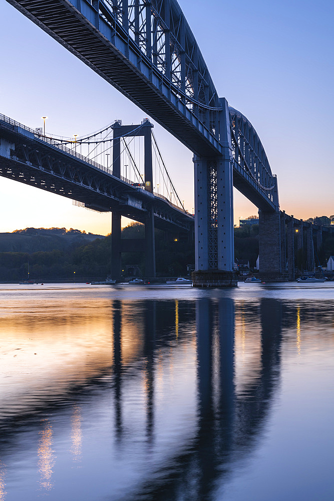 Dawn sky behind Brunel's Royal Albert Bridge and the Tamar Bridge in spring, Saltash, Cornwall, England, United Kingdom, Europe