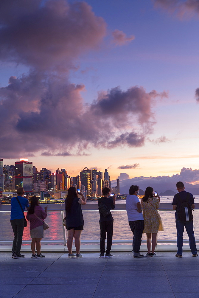 People watching sunset from Harbour City, Hong Kong, China, Asia