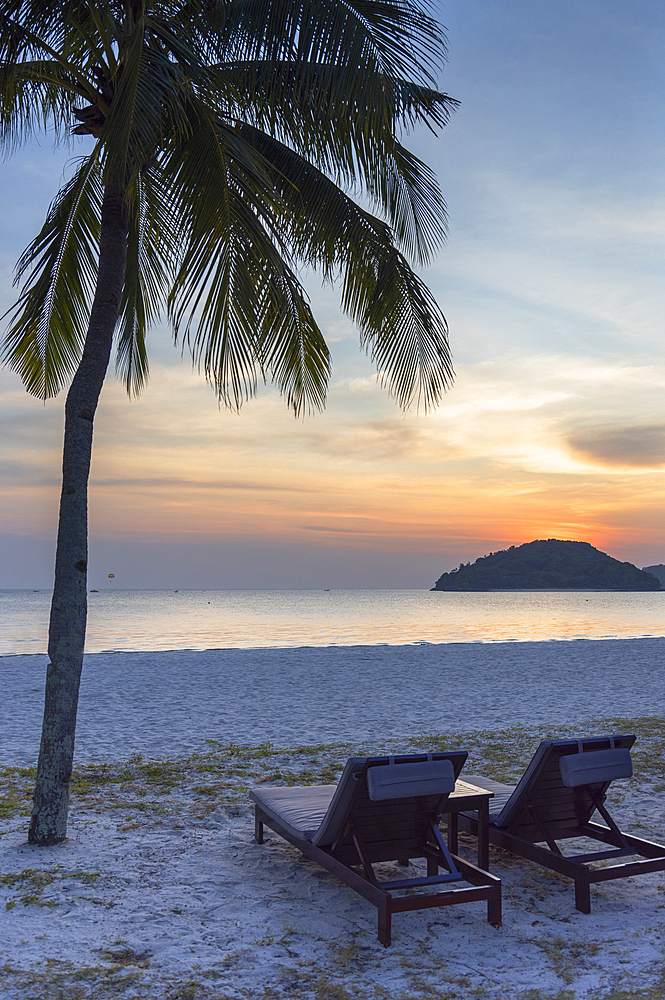 Sun loungers at Pelangi Beach Resort and Spa at sunset, Cenang Beach, Langkawi, Kedah, Malaysia