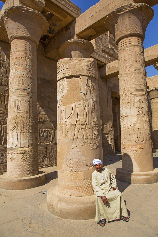 Caretaker, Columns with Reliefs, Temple of Sobek and Haroeris, Kom Ombo, Egypt, North Africa, Africa