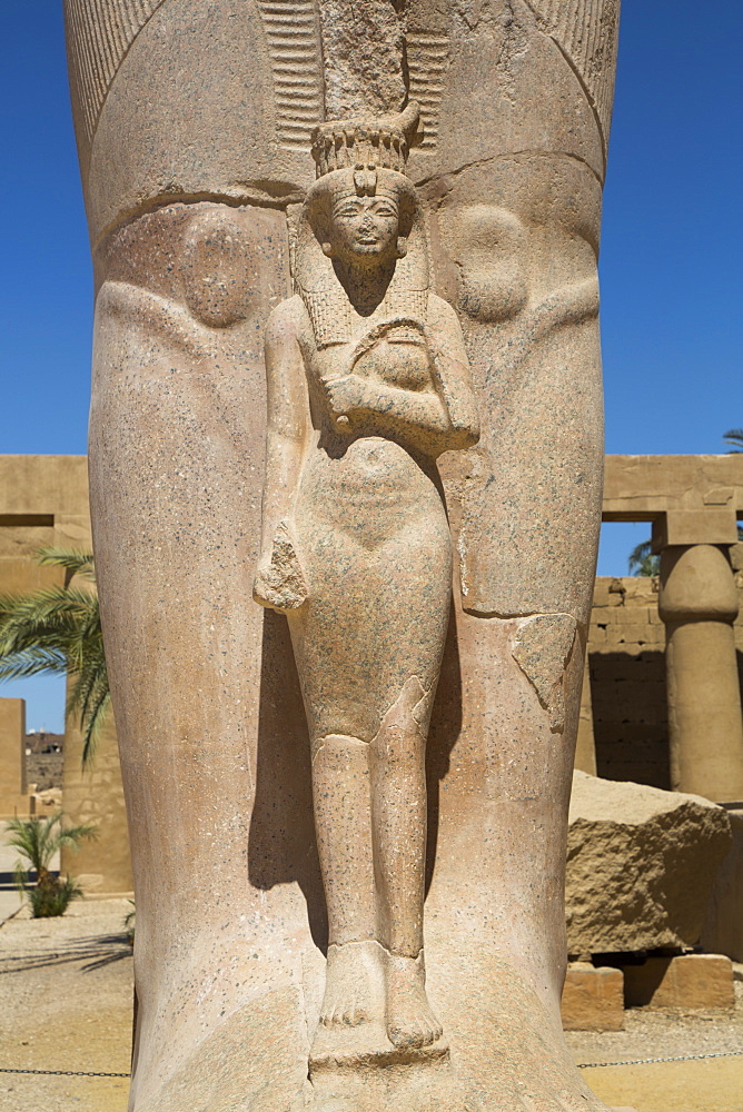 Statue of Nefetari, at base of statue of Ramses II, Great Court, Karnak Temple Complex, UNESCO World Heritage Site, Luxor, Thebes, Egypt, North Africa, Africa