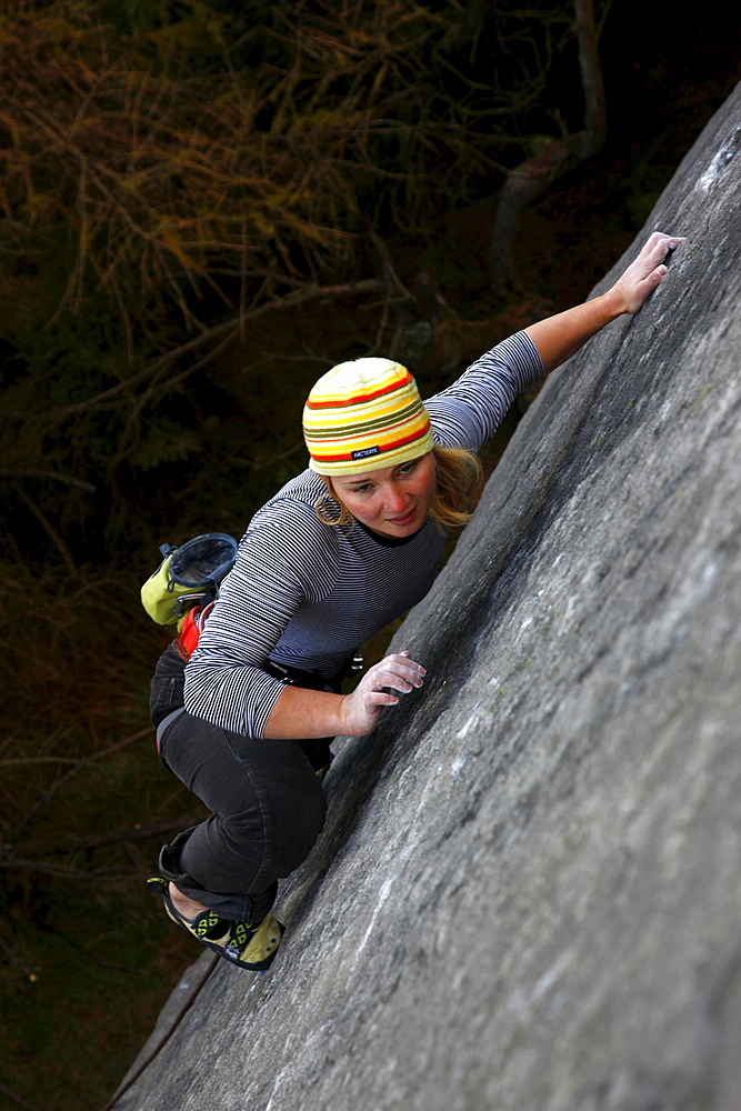 A climber on a difficult route on the cliffs known as The Roaches, Staffordshire, Peak District, England, United Kingdom, Europe