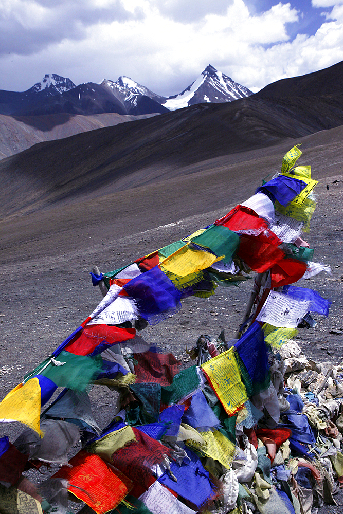 Prayer flags on a stupa high in the Zanskar Range, Ladakh, Himalayas, India, Asia