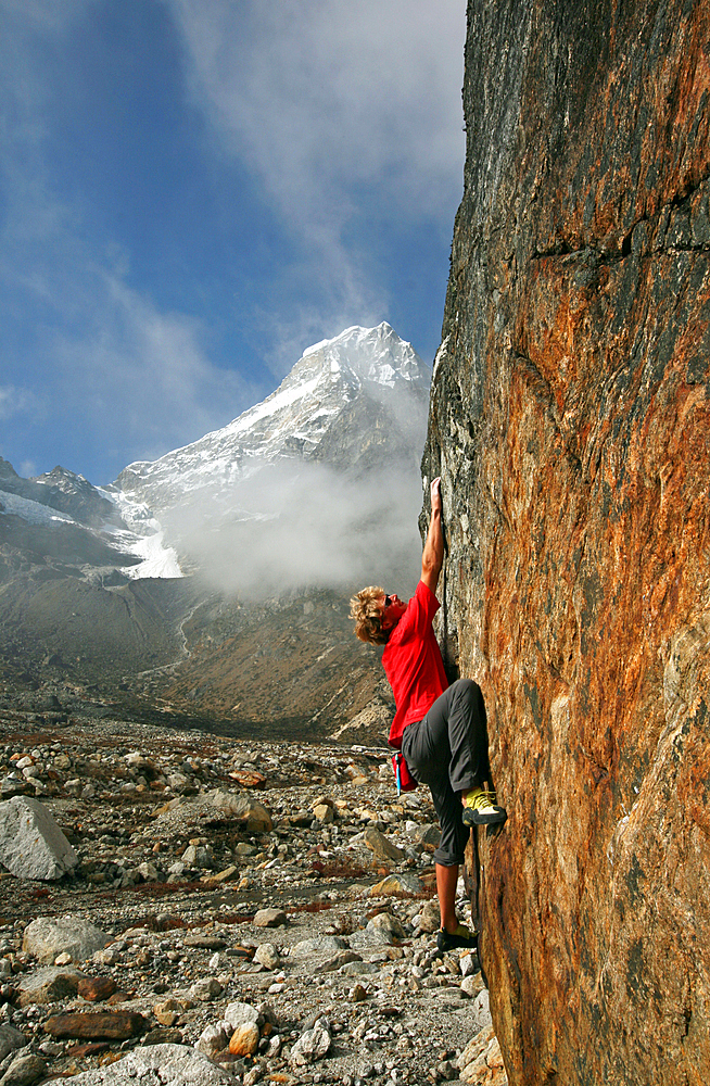 Climber bouldering at Tangnag moraine, Khumbu, Himalayas, Nepal, Asia