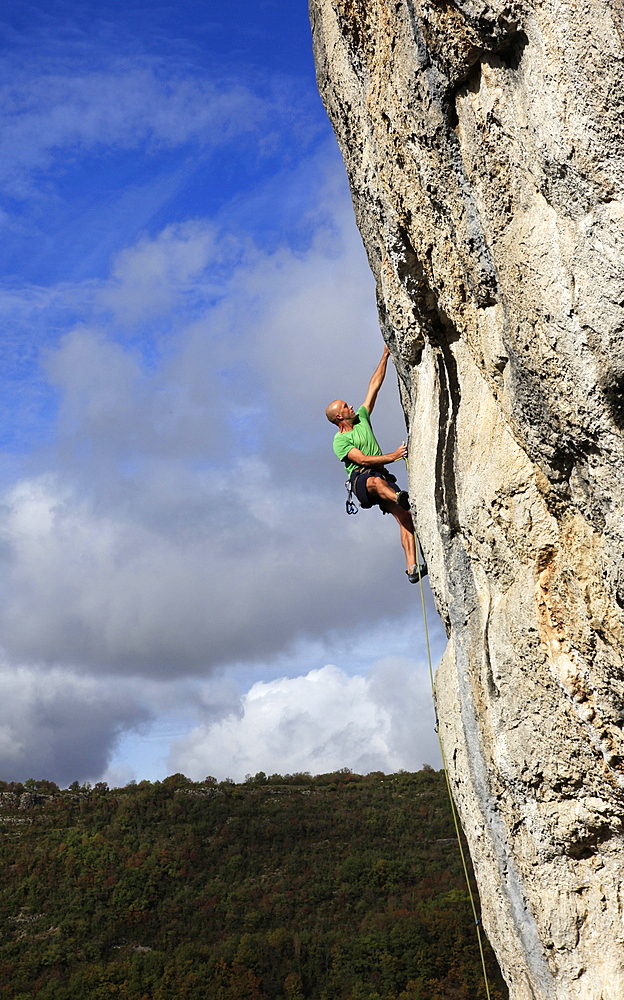 A climber tackles a very difficult rock climb in the Gorge d'Aveyron, near St. Antonin and Gaillac, Massif Central, France