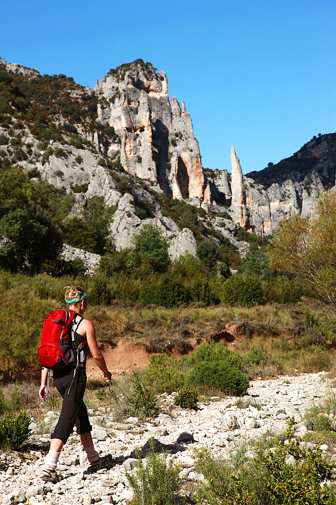 Woman hiking in the Mascun Gorge, one of Europe's most popular canyoning destinations, Sierra de Guara mountains, Aragon, Spain