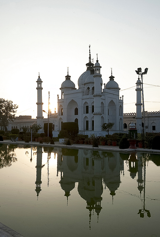 Tomb of Princess Zinat Asiya, daughter of King Mohammad Ali Shah Bahadur, reflected in water at the Chota Imambara, Lucknow, Uttar Pradesh, India, Asia