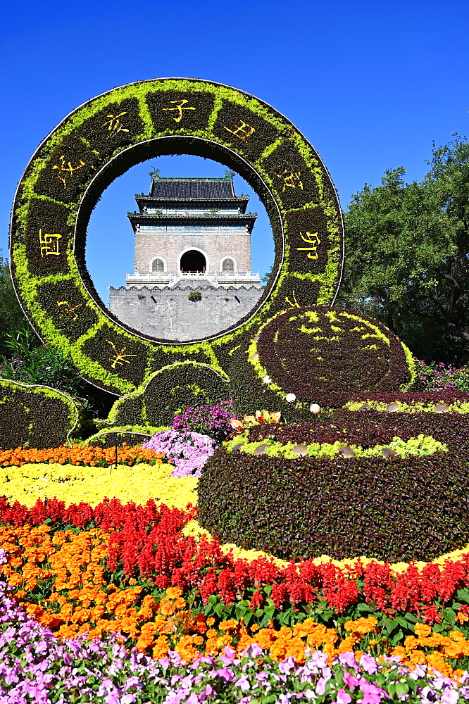 Elaborate floral decorations celebrating 70 years of China framing the Bell Tower, built in 1272, Beijing, China, Asia