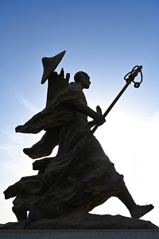 Statue of 7th century monk, Xuanzang, carrying Buddhist sutras, Gaochang ruins, Xinjiang, China, Asia