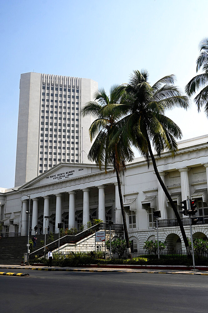 Modern skyscraper block towers above the 200 year old Asiatic Society Library and Town Hall built in 1804, Mumbai, India, Asia