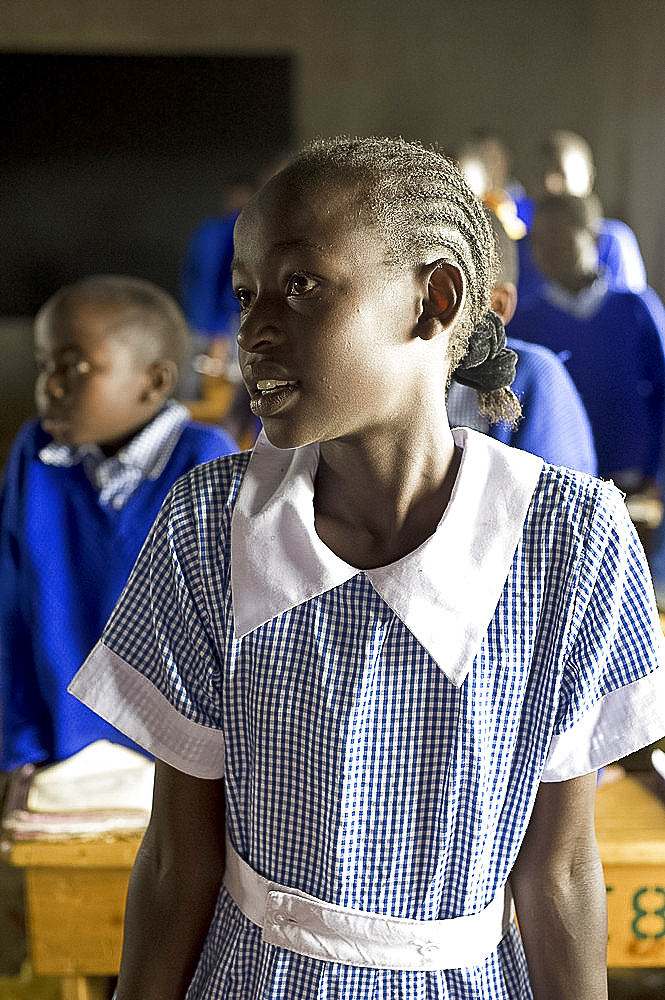 Schoolgirl listening to teacher in a lesson, Karunga Primary School, Rift Valley, Kenya, East Africa, Africa