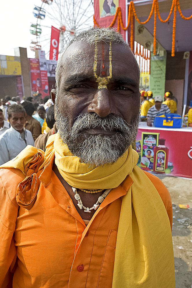 Bihari villager, a Vishnaivite devotee with tilak on his forehead indicating the Hindu god Vishnu, wearing orange clothing for visit to the Vishnu temple at Sonepur Cattle Fair, near Patna, Bihar, India, Asia