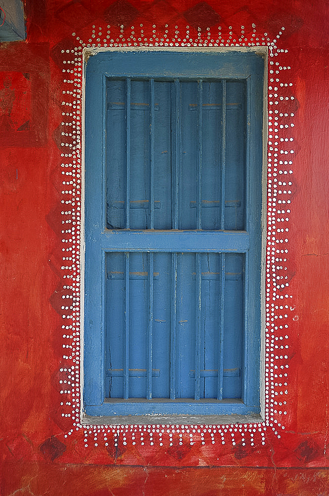 Decorated shuttered window in painted bhunga wall, Dhordo village, Kachchh, Gujarat, India, Asia