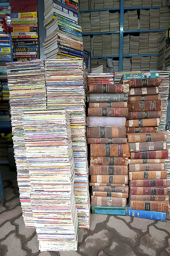 Piles of secondhand books for sale in College Street, famous for its book stalls, North Kolkata, West Bengal, India, Asia