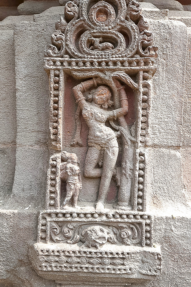 Erotic carving of woman on the 11th century Rajarani temple, known as the love temple, dedicated to Lord Shiva, Bhubaneshwar, Orissa, India, Asia