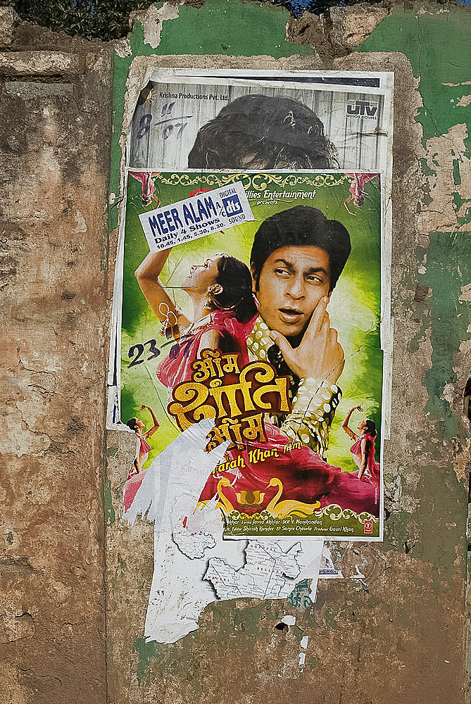 Shahruk Khan in torn Bollywood movie poster on wall, Hospet, Karnataka, India, Asia