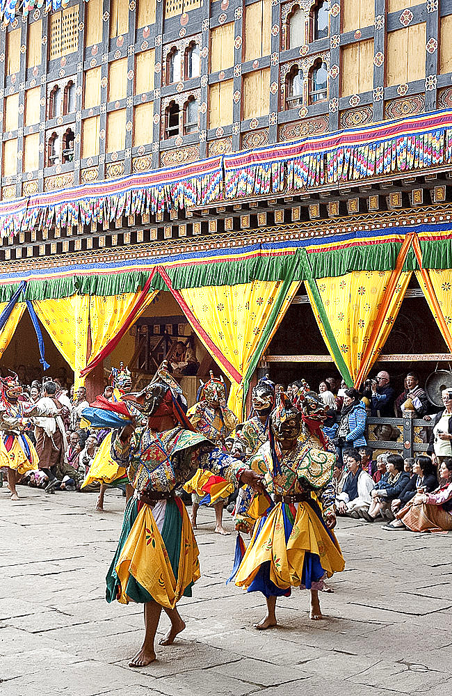 Monks in costume and animal masks performing ceremonial dance at Paro Tsechu (annual festival), Paro Dzong (monastery), Paro, Bhutan, Asia