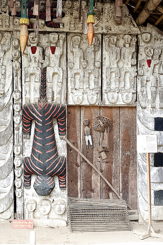 Manipur house of wood carved from animist origins in the Heritage Centre run by the Mutua Museum, Andro Scheduled Caste village, Andro, Manipur, India, Asia