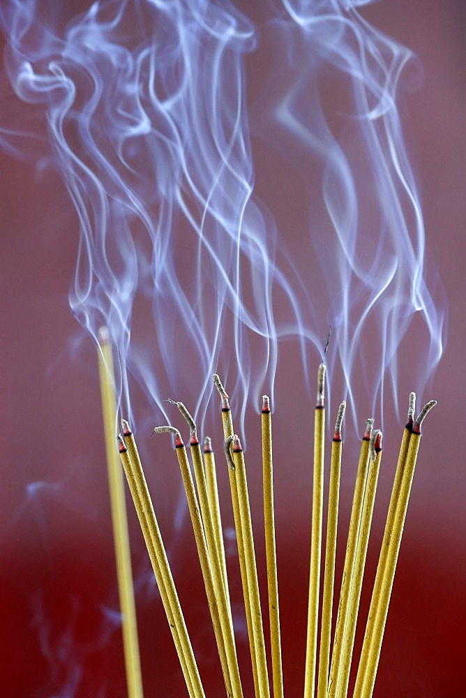 Incense sticks on joss stick pot burning, smoke used to pay respect to the Buddha, Vung Tau, Vietnam, Indochina, Southeast Asia, Asia