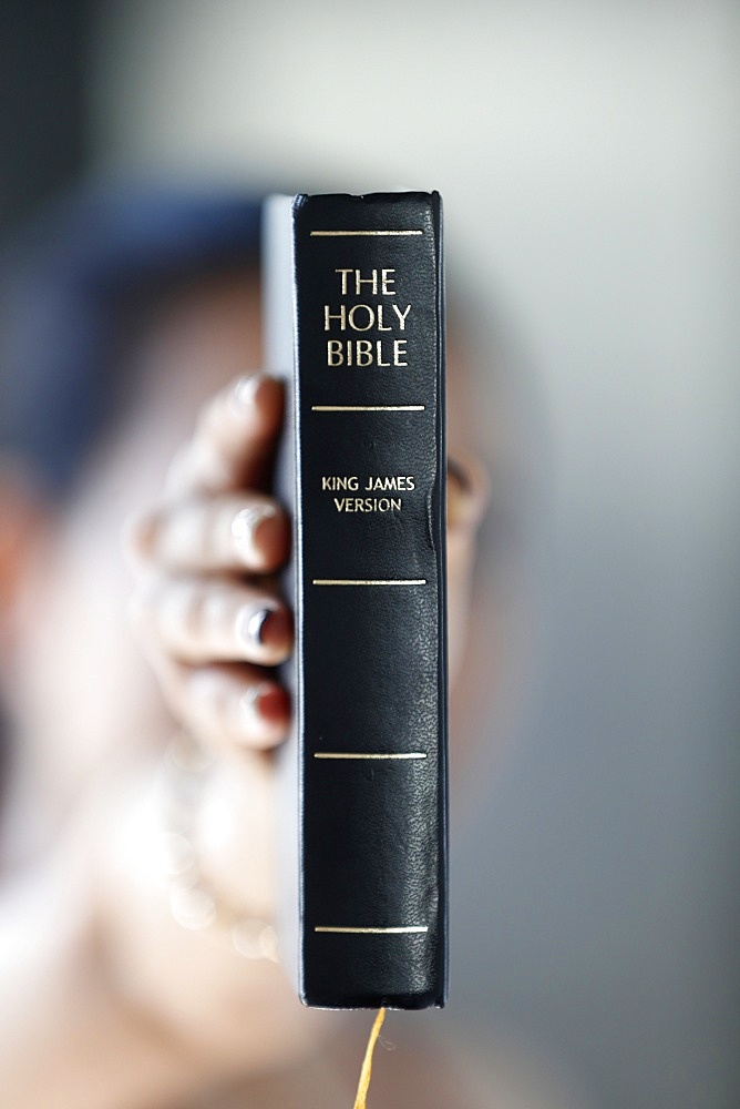 Catholic woman with the Holy Bible in hands, Vietnam, Indochina, Southeast Asia, Asia