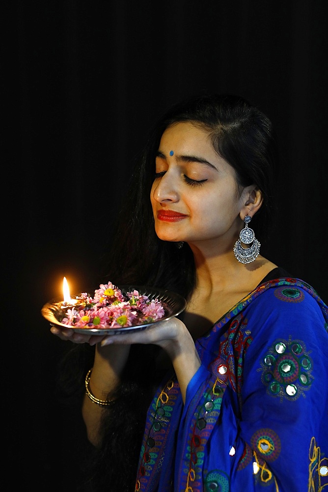 Indian dancer holding a Diwali tray, Paris, France, Europe