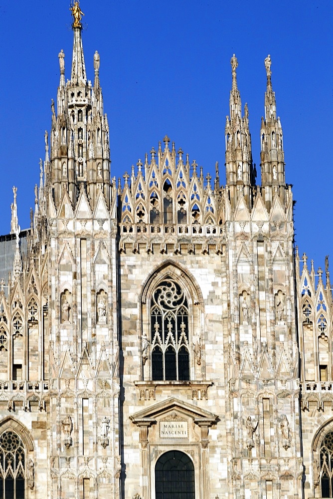 The west facade of the Duomo, the Gothic style cathedral dedicated to St. Mary, Milan, Lombardy, Italy, Europe