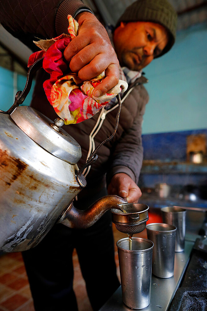 Pouring traditional Nepalese tea, Charikot, Nepal, Asia