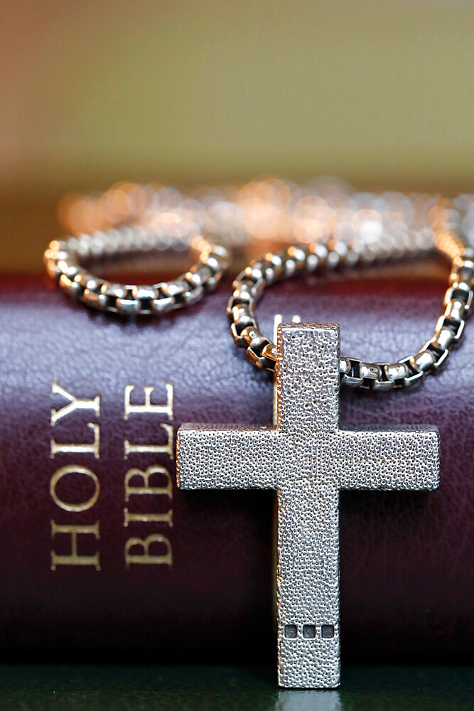 Holy Bible book with a Christian cross, symbol of Christianity, Yonne, France, Europe