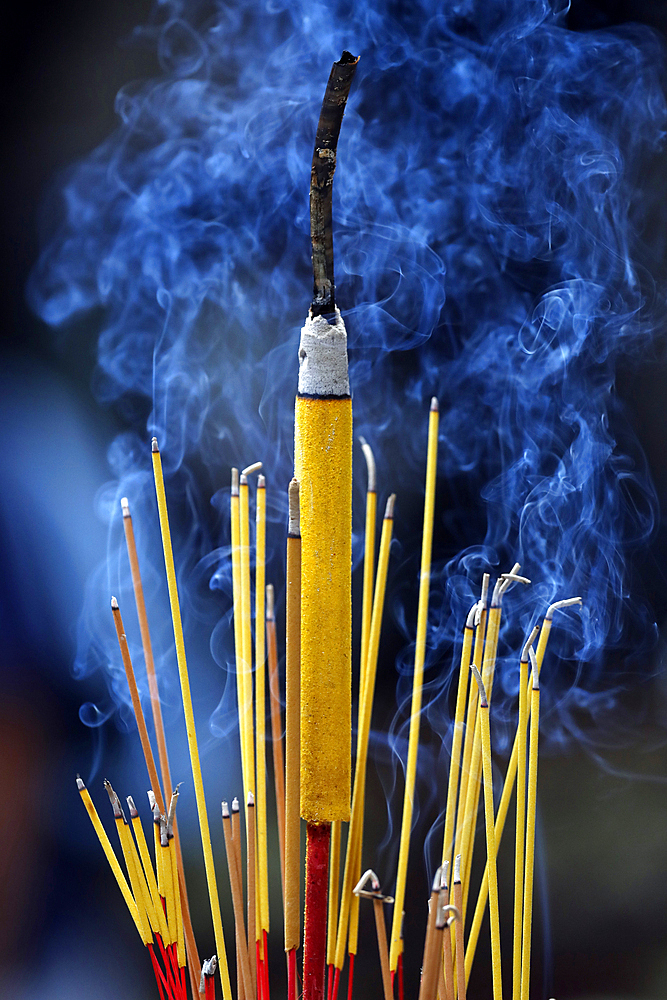 Smoking incense sticks, Ba Thien Hau Chinese Temple, Ho Chi Minh City, Vietnam, Indochina, Southeast Asia, Asia